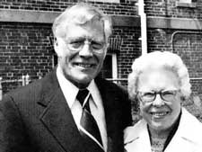 C. Leslie Strand with a white-haired woman, both smiling