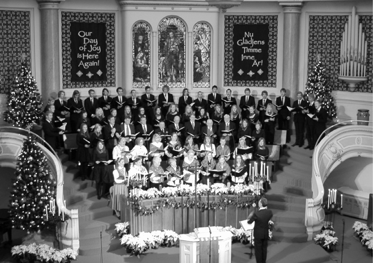 Photo of a large choir in the sanctuary of First Covenant Church, Seattle